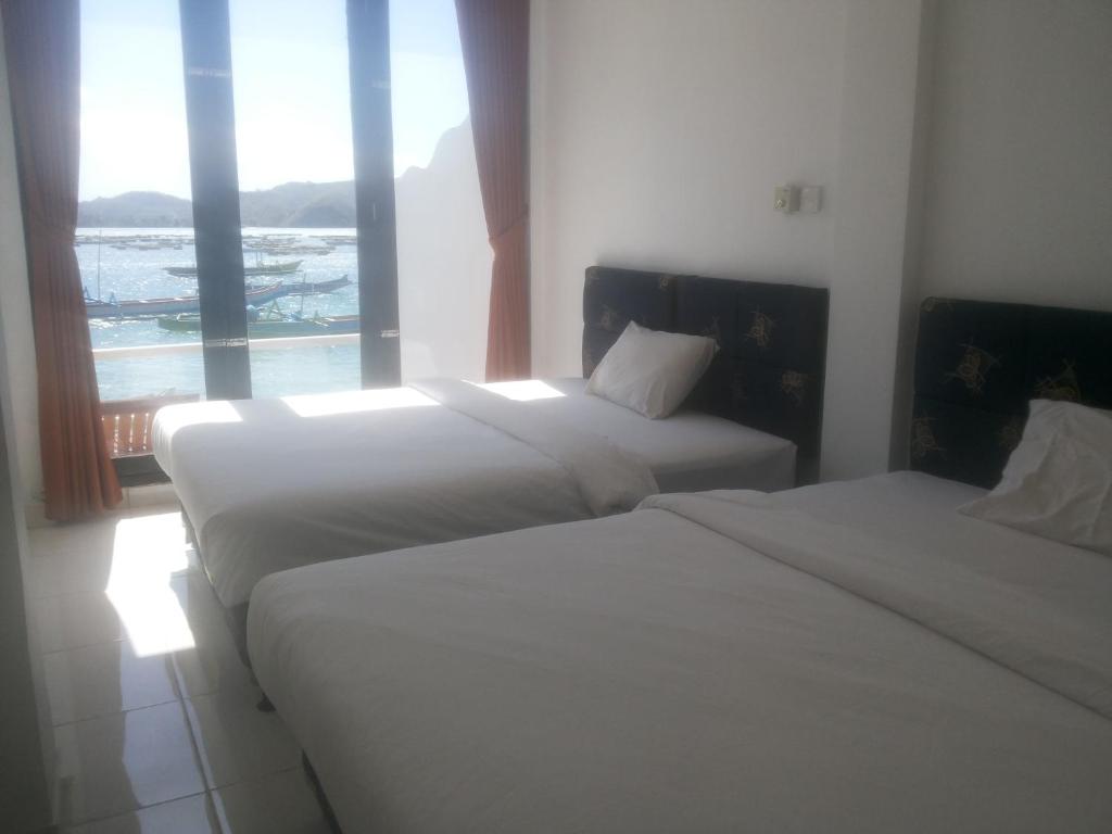 Postel nebo postele na pokoji v ubytování Spear Beach House