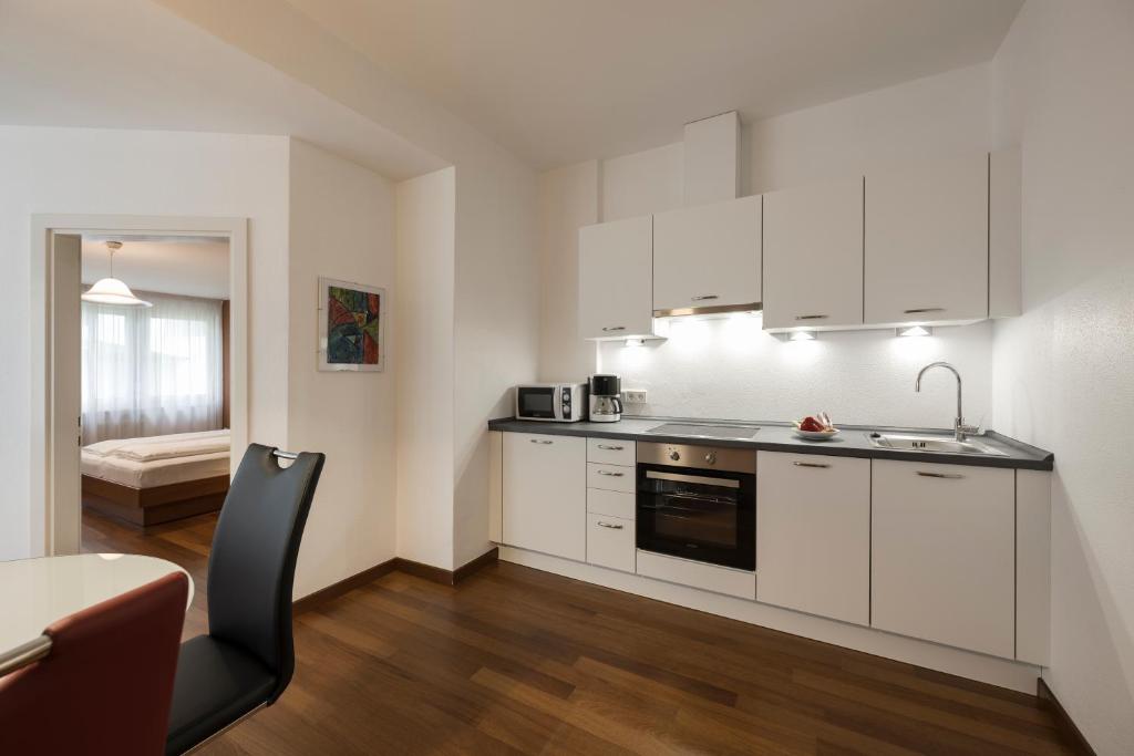 Kuchyňa alebo kuchynka v ubytovaní Residence Désirée Classic & Design