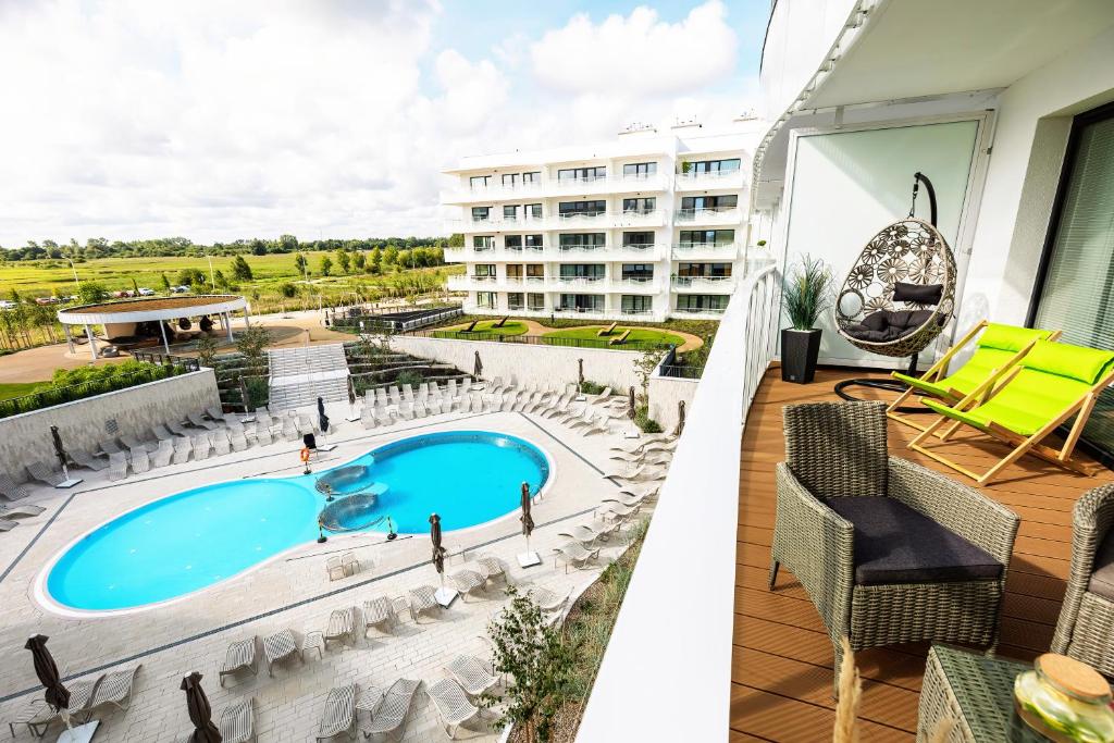 Bazén v ubytovaní Horyzont Apartamenty -Polanki AQUA- Strefa SPA z basenem i fitness studio, prywatny garaż alebo v jeho blízkosti