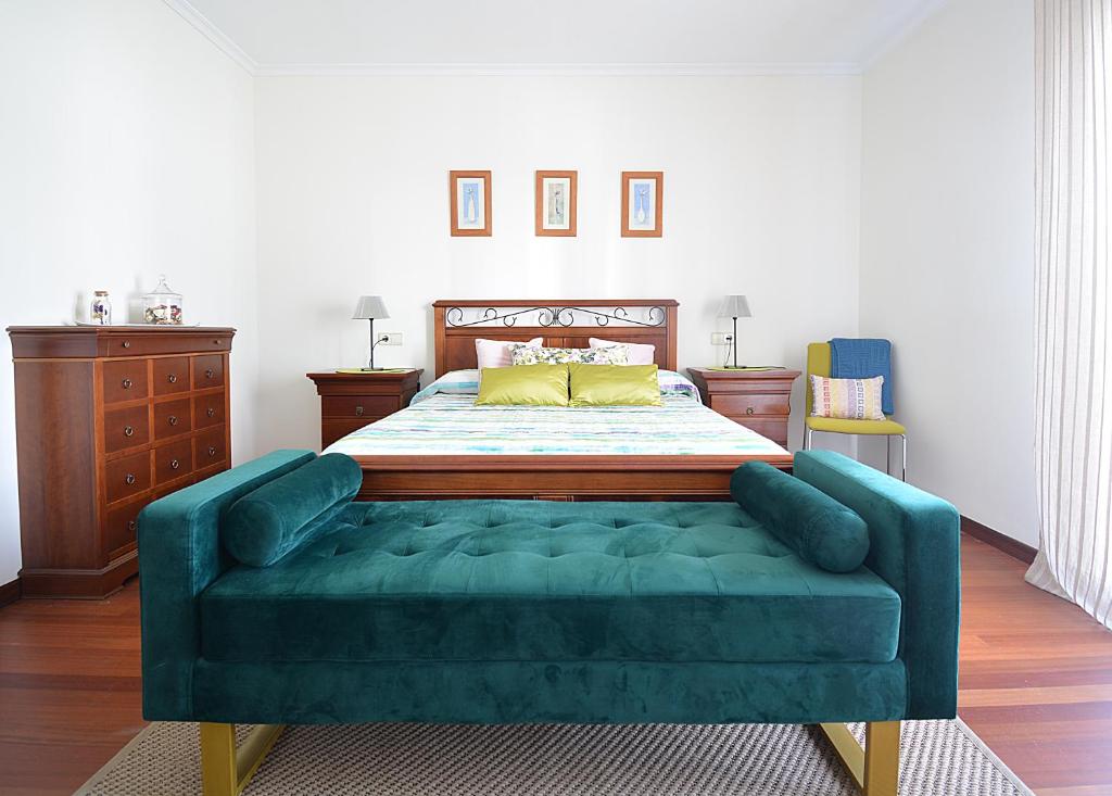 Ένα ή περισσότερα κρεβάτια σε δωμάτιο στο Apartamento con terraza en el entorno de Sanxenxo