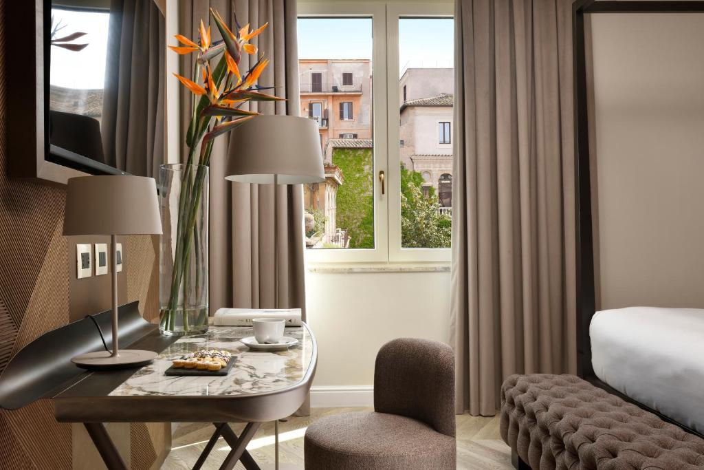 Postel nebo postele na pokoji v ubytování FH55 Grand Hotel Palatino