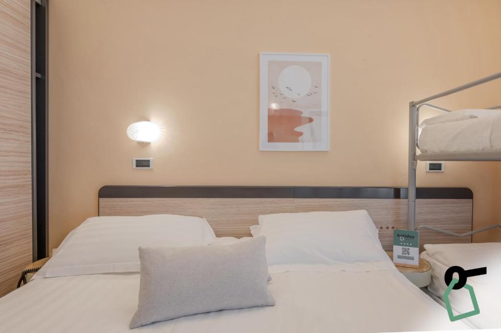 Postel nebo postele na pokoji v ubytování HOTIDAY Room Collection - Giulianova