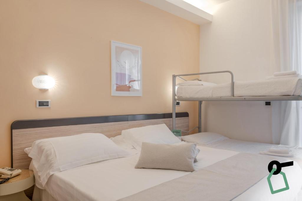 Postel nebo postele na pokoji v ubytování HOTIDAY Room Collection - Giulianova