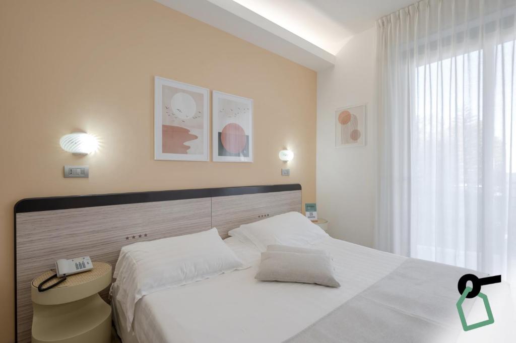 Postel nebo postele na pokoji v ubytování HOTIDAY Room Collection - Giulianova