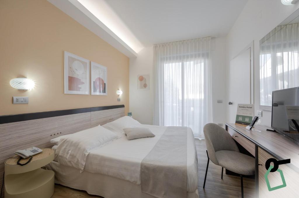 Postel nebo postele na pokoji v ubytování HOTIDAY Room Collection - Giulianova