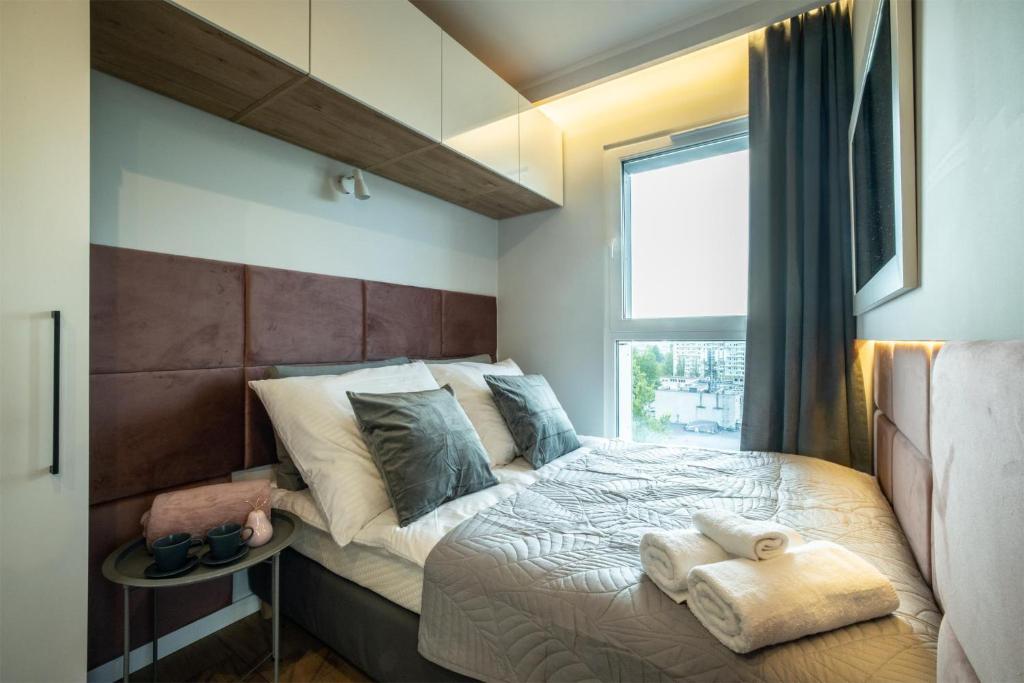 Katil atau katil-katil dalam bilik di WiguryTower Apartaments 90