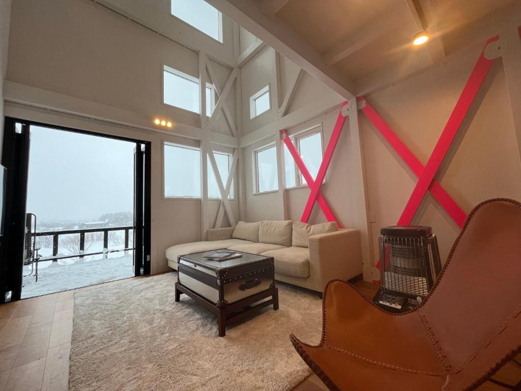 Χώρος καθιστικού στο Straddie House Niseko