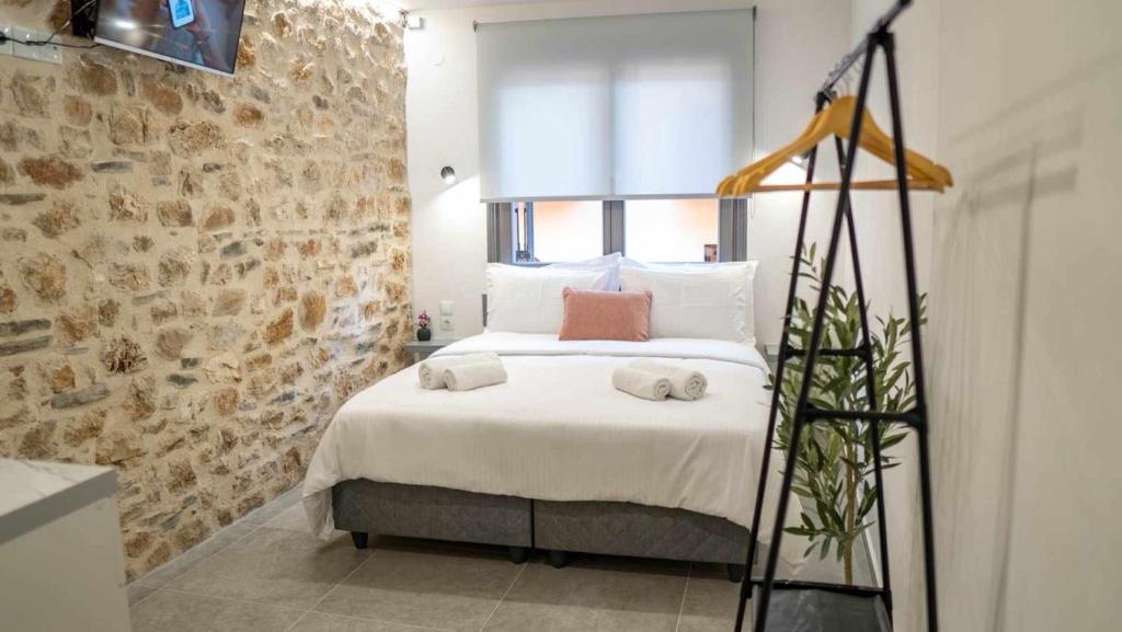 Postel nebo postele na pokoji v ubytování 1900 Apartments Ioannina