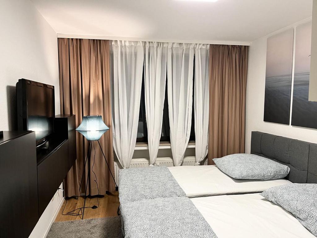 Katil atau katil-katil dalam bilik di Nice Apartment in Düsseldorf