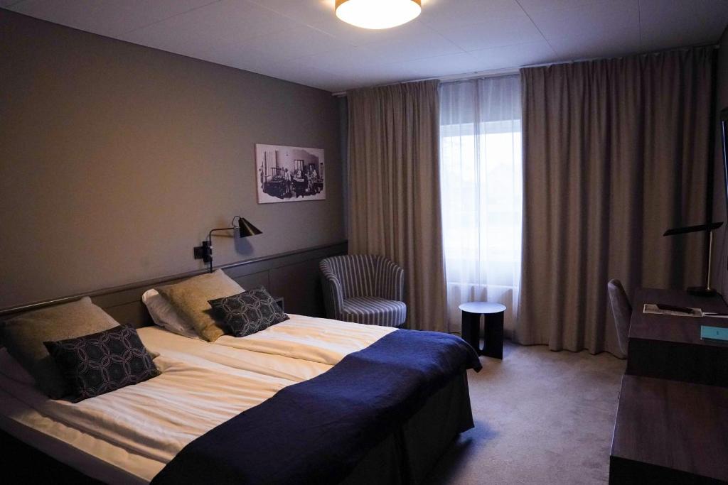 Postel nebo postele na pokoji v ubytování Home Hotel Kompaniet
