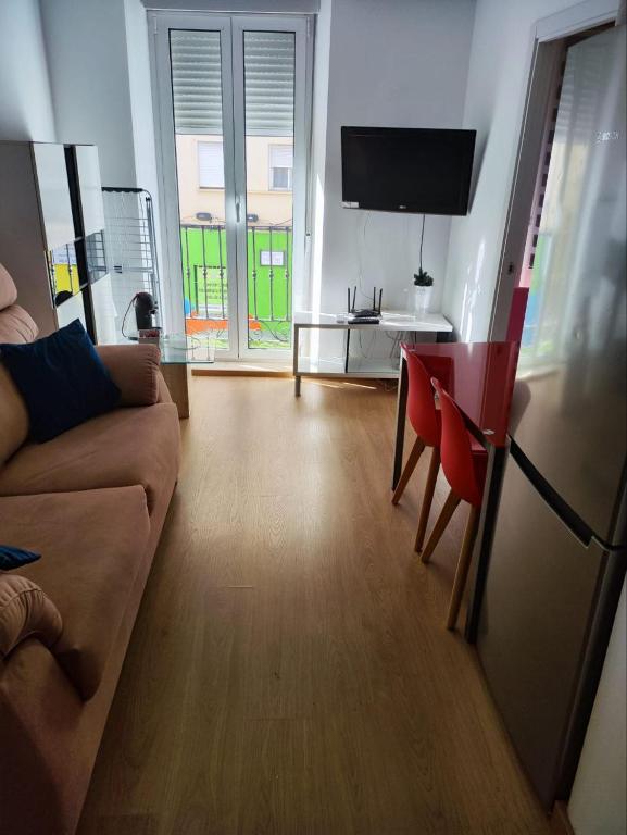 Televízia a/alebo spoločenská miestnosť v ubytovaní Los Tilos Apartments
