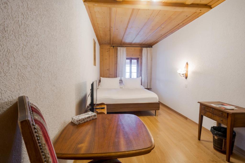 Postel nebo postele na pokoji v ubytování La Fleur de Lys