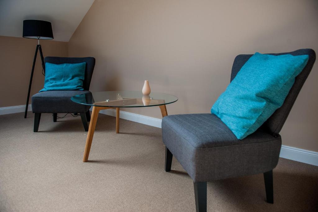 Posezení v ubytování Braun Rooms Deluxe