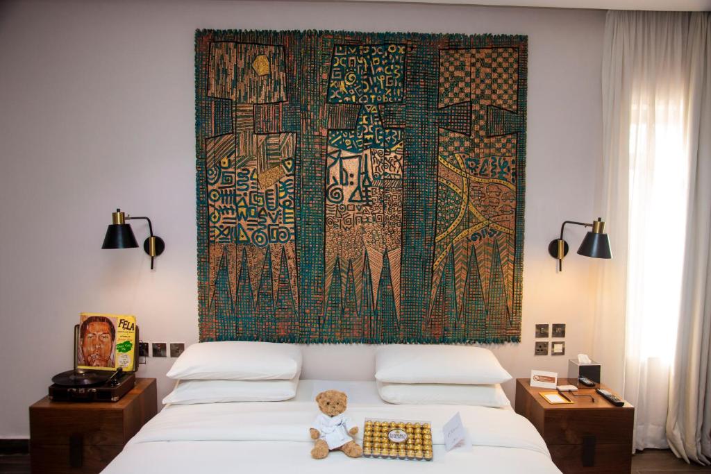 Postel nebo postele na pokoji v ubytování The White Orchid Hotel