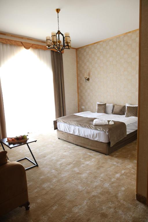 Postel nebo postele na pokoji v ubytování BMG Hotel by Grigoryans Group