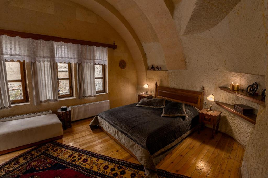 A bed or beds in a room at Hotel Temenni Evi