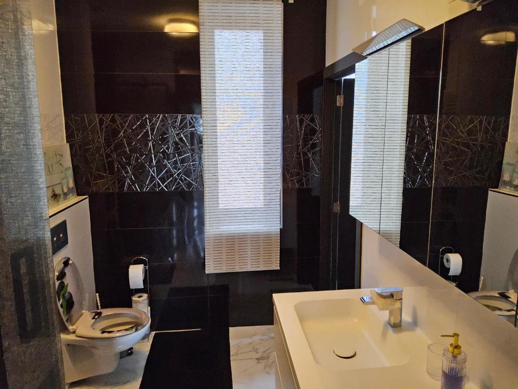 Koupelna v ubytování Chambre deluxe au 2ème étage, chambre double au 4ème étage NOT A HÔTEL
