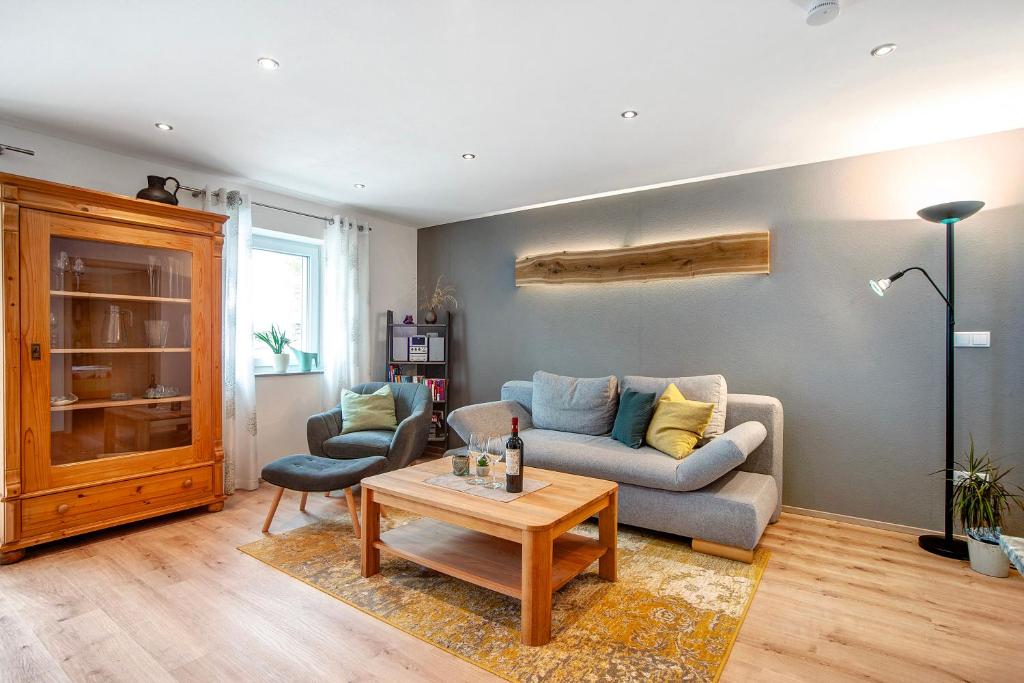 a living room with a couch and a table at Ferienwohnung Birke in Altusried