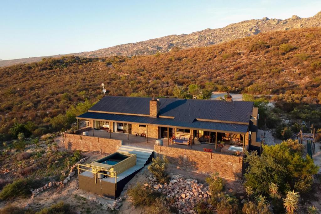 an overhead view of a house with a mountain at Wolfkop Nature Reserve in Citrusdal