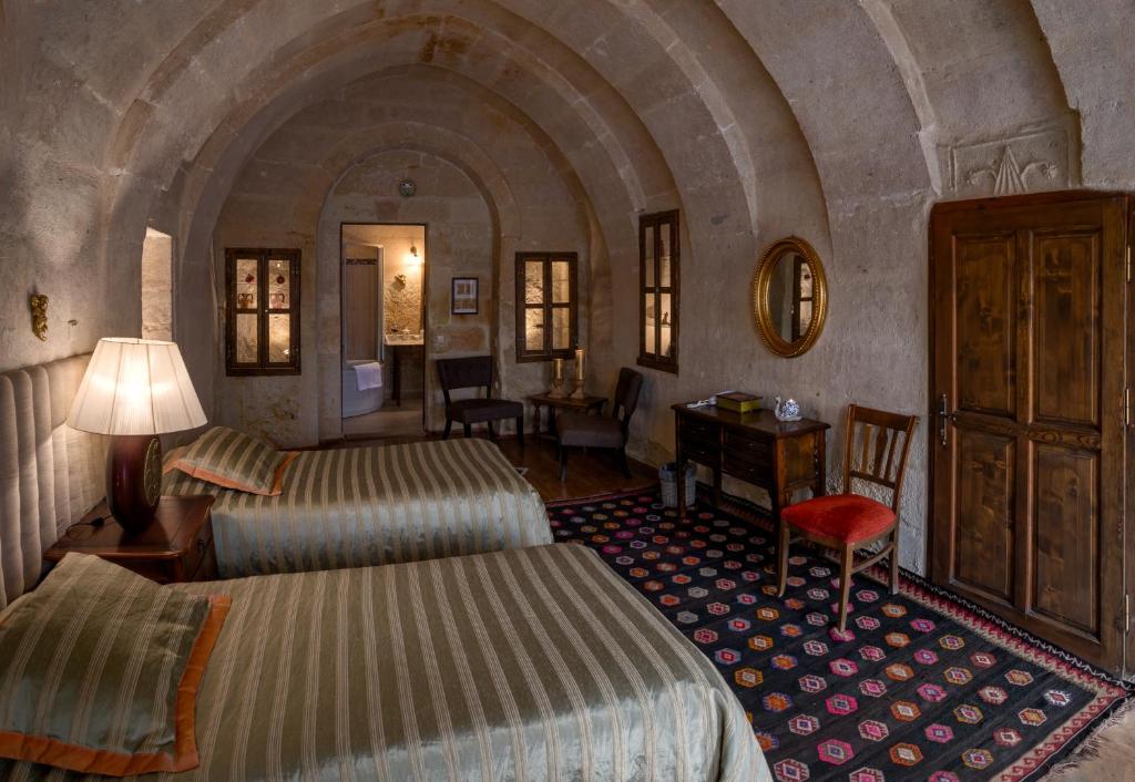 A bed or beds in a room at Hotel Temenni Evi