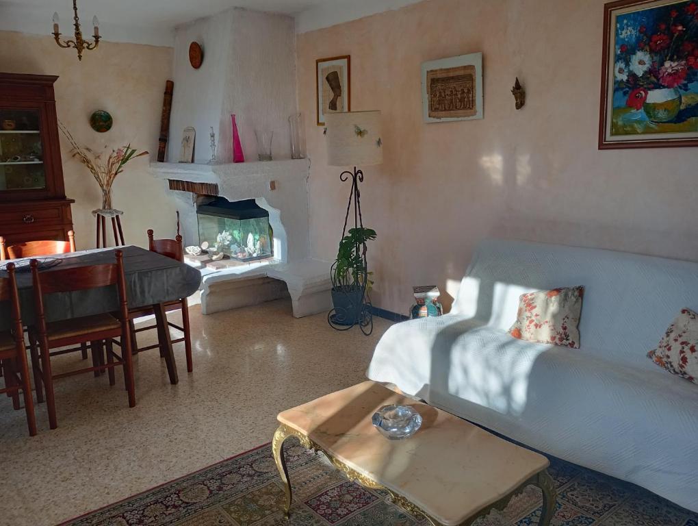 a living room with a couch and a table at Aix en Provence in Aix-en-Provence