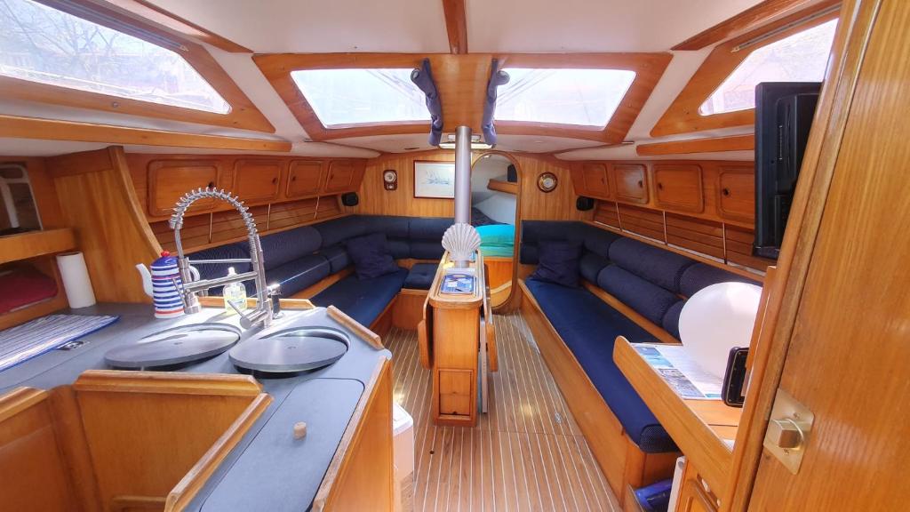 a view of a boat with a kitchen and a sink at Super Castor - Dormir sur un grand voilier 6 personnes By Nuits au Port in La Rochelle