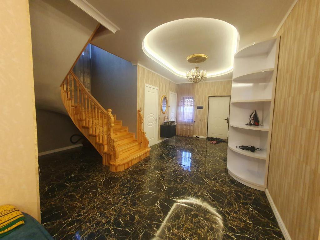 a hallway with a staircase in a house at Villa in Quba in Quba