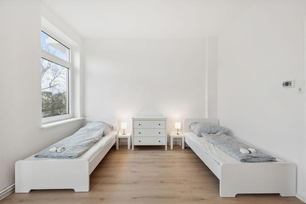 Un pat sau paturi într-o cameră la Nice Apartment in Bremerhaven