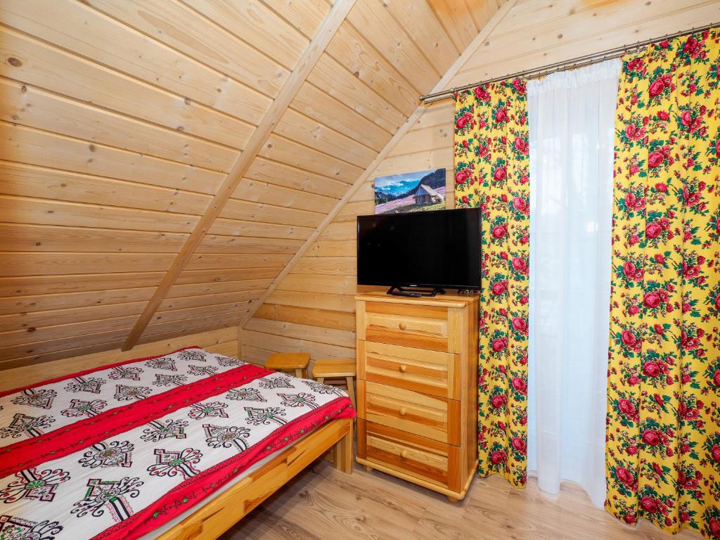 Postel nebo postele na pokoji v ubytování Domki i Pokoje obok Term Chochołów U Tadka