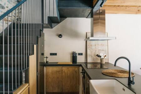 Kuchyň nebo kuchyňský kout v ubytování Cal Rus Apartament 3