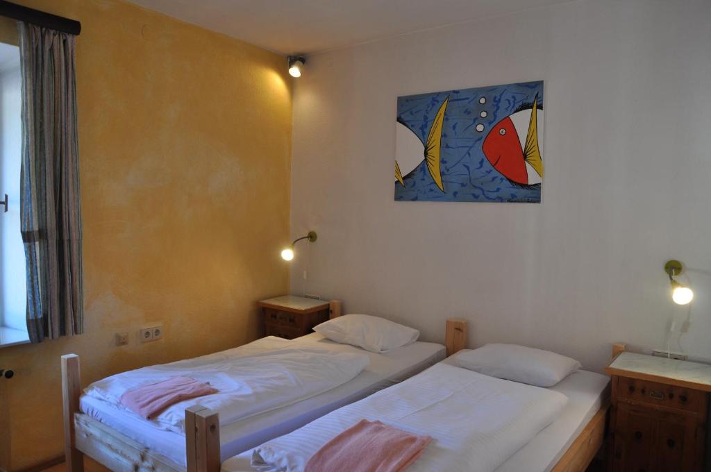 Postel nebo postele na pokoji v ubytování Hotel Schwarzer Adler Sillian