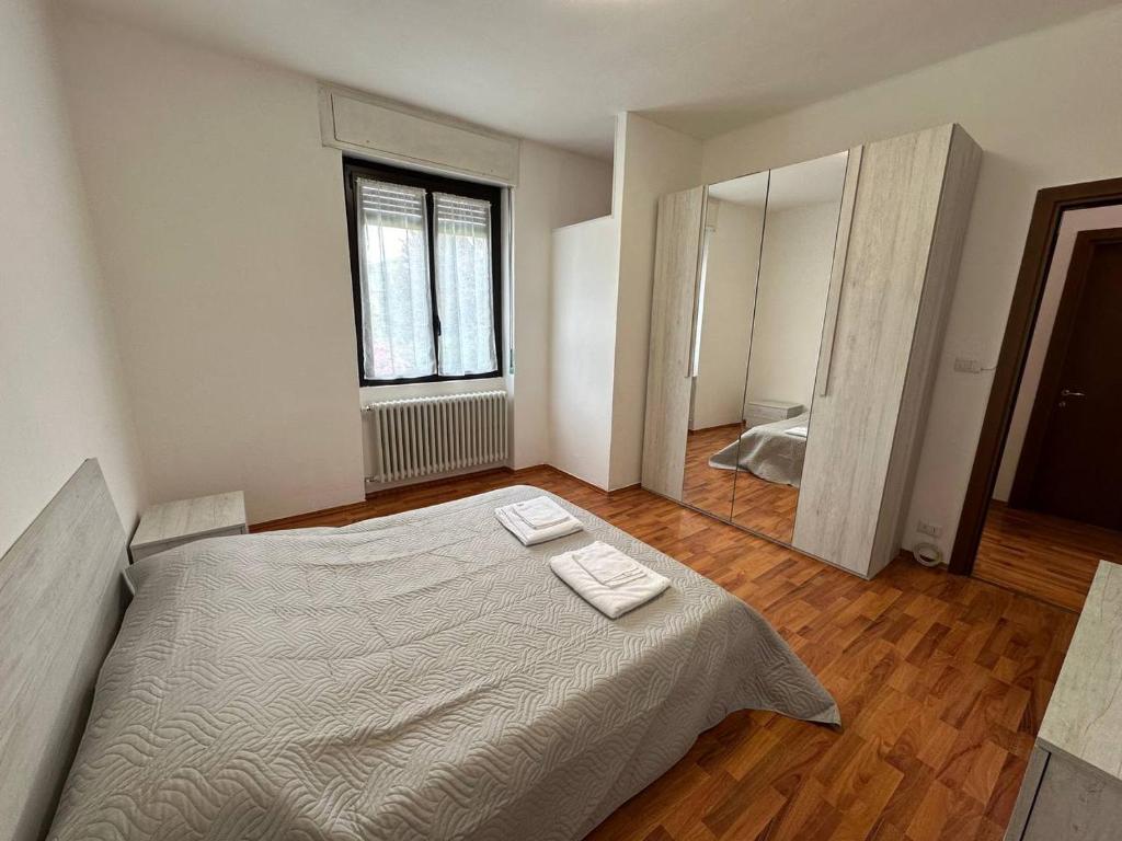 מיטה או מיטות בחדר ב-Il Laghetto - Residenza