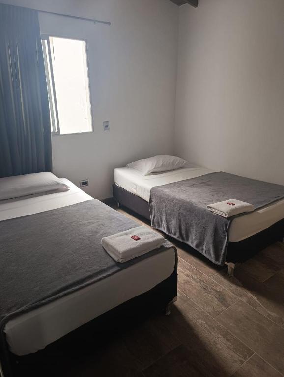 Postel nebo postele na pokoji v ubytování Hotel Prestige