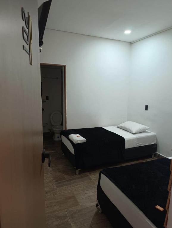 Postel nebo postele na pokoji v ubytování Hotel Prestige