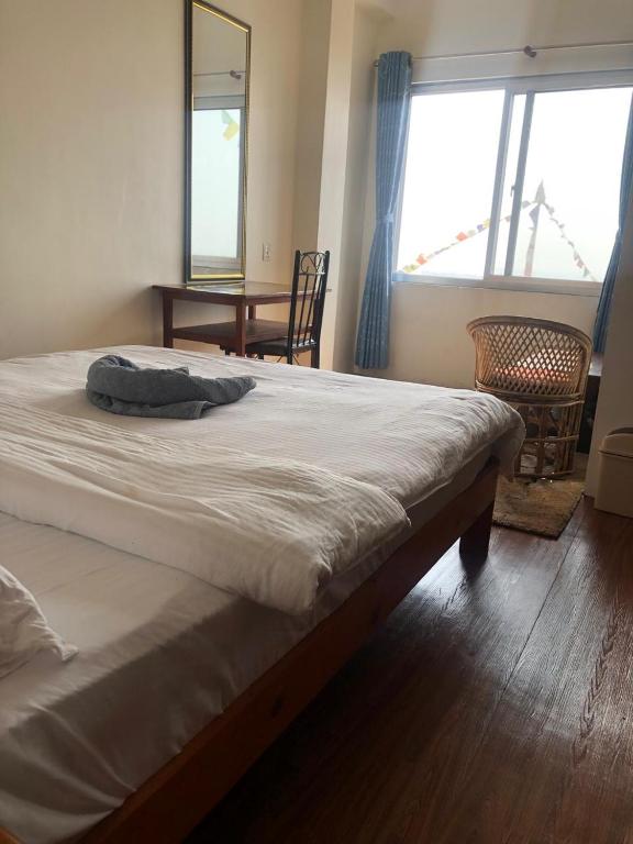 Postel nebo postele na pokoji v ubytování Green Mandala Inn