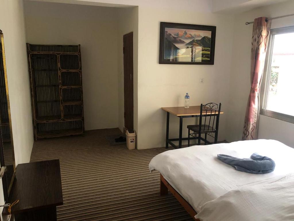 Postel nebo postele na pokoji v ubytování Green Mandala Inn