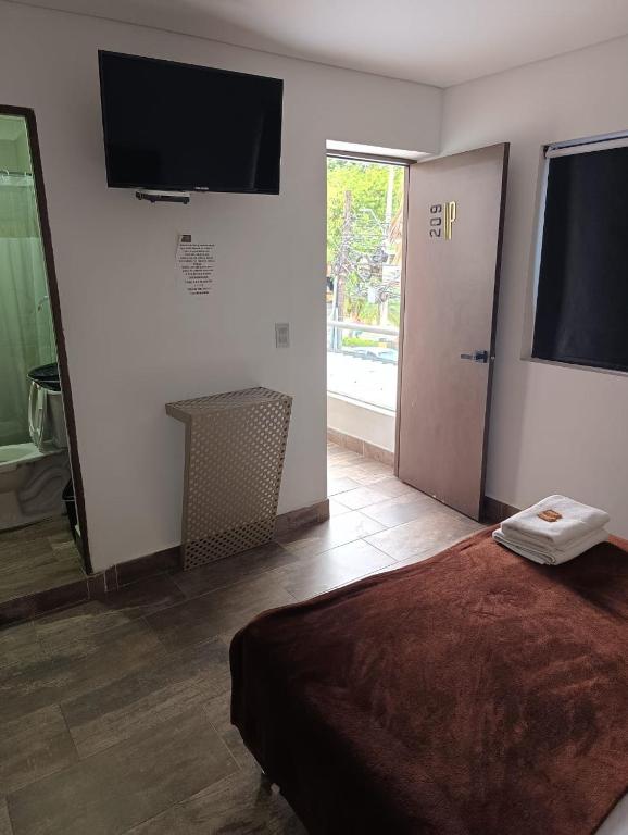 TV a/nebo společenská místnost v ubytování Hotel Prestige