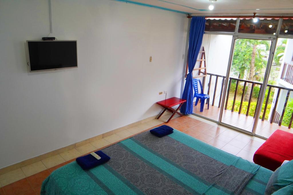 Postel nebo postele na pokoji v ubytování Hotel Canoa´s Wonderland