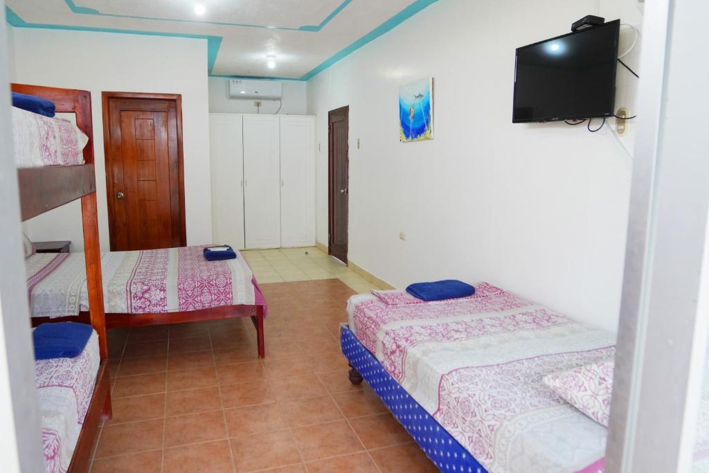 Postel nebo postele na pokoji v ubytování Hotel Canoa´s Wonderland