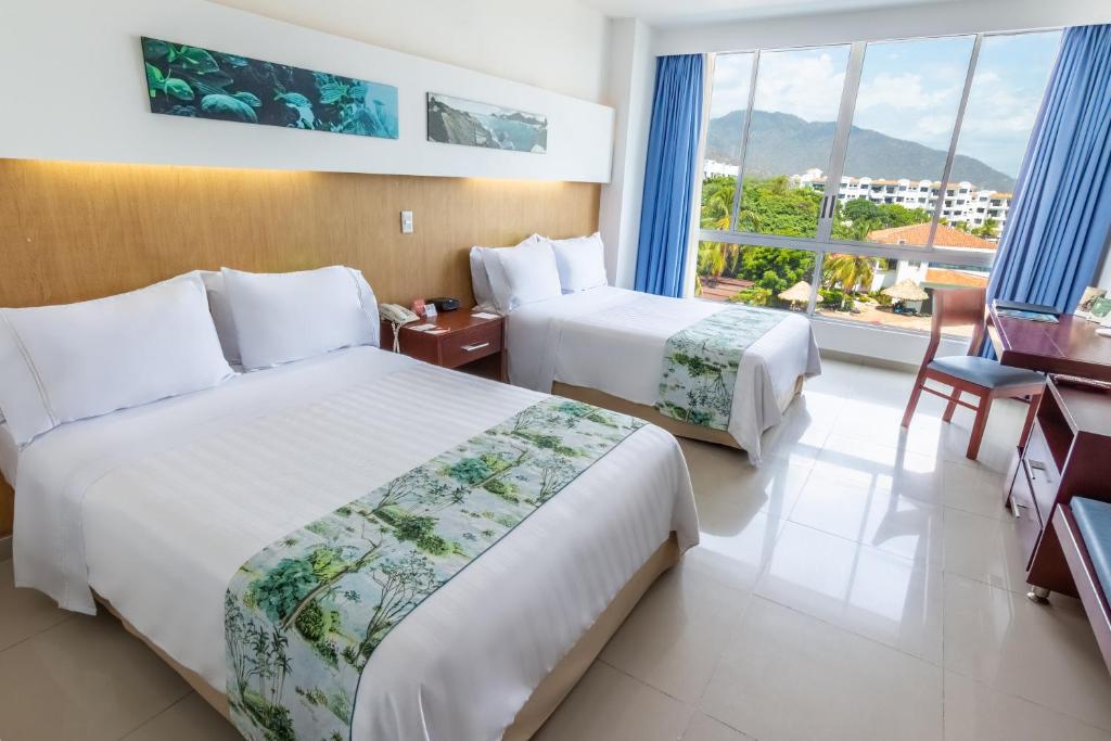 Postel nebo postele na pokoji v ubytování GHL Relax Hotel Costa Azul