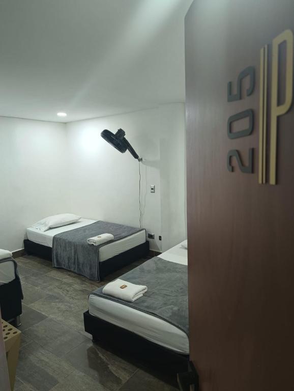 Postel nebo postele na pokoji v ubytování Hotel Prestige