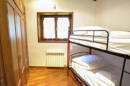 Postel nebo postele na pokoji v ubytování Casa Prat de la Quimeta
