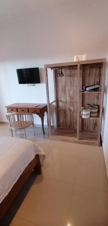 TV a/nebo společenská místnost v ubytování D'tegal Guest House