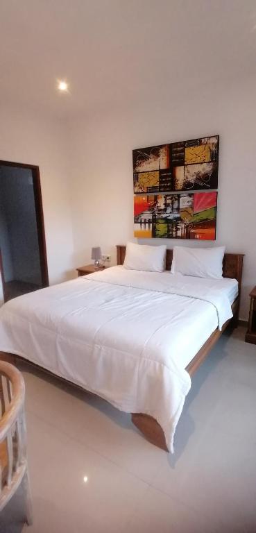 Postel nebo postele na pokoji v ubytování D'tegal Guest House