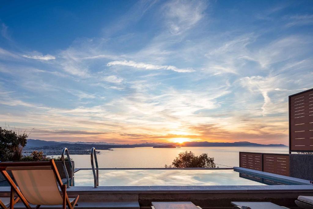 a swimming pool with a view of a lake at Omnia Luxury Villas in Chania Town
