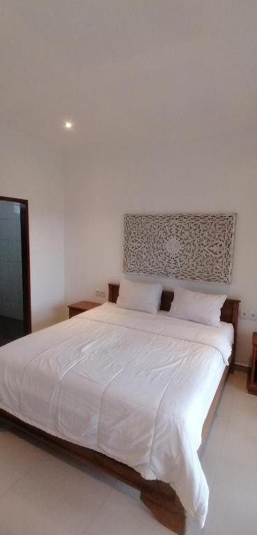 Postel nebo postele na pokoji v ubytování D'tegal Guest House
