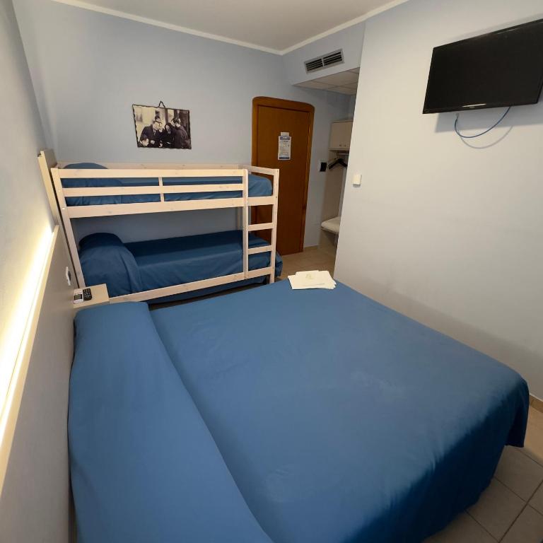 Postel nebo postele na pokoji v ubytování Hotel Immagine