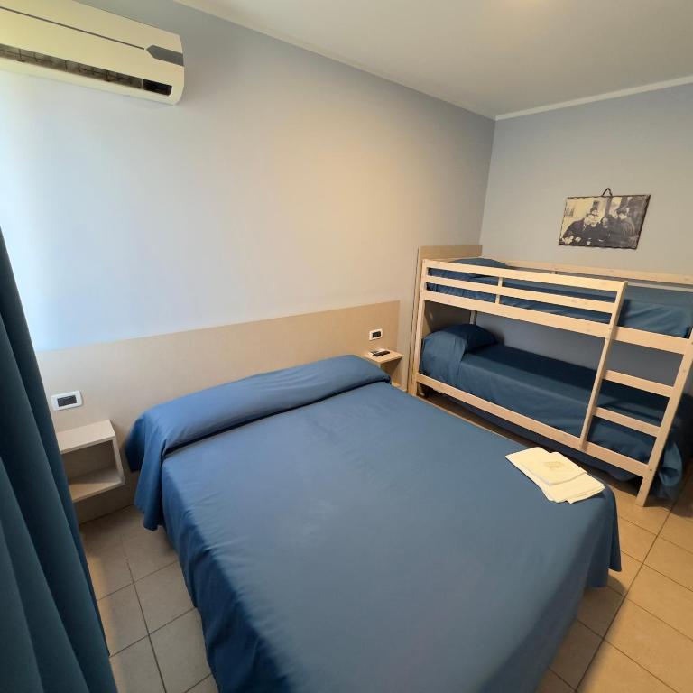 Postel nebo postele na pokoji v ubytování Hotel Immagine