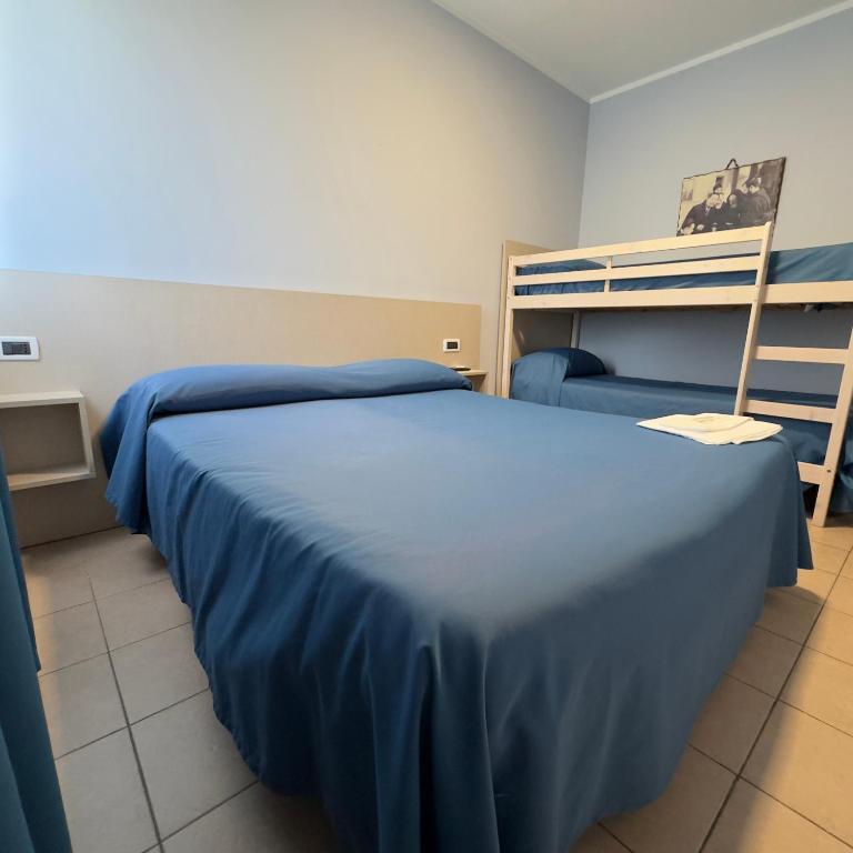 Postel nebo postele na pokoji v ubytování Hotel Immagine