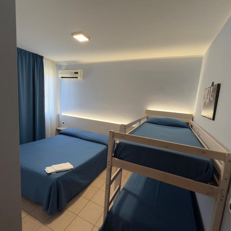 Postel nebo postele na pokoji v ubytování Hotel Immagine